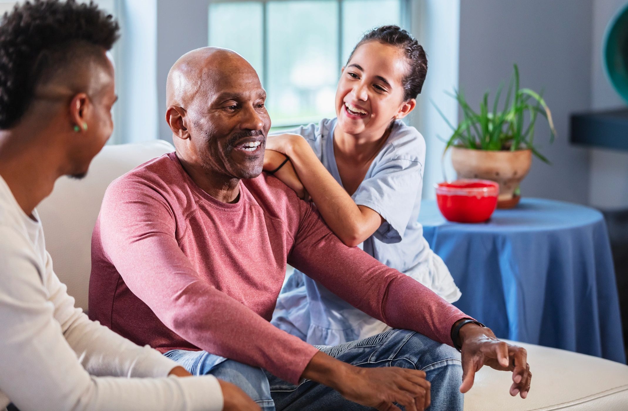 Professional caregiver helping a senior with daily activities in a home setting