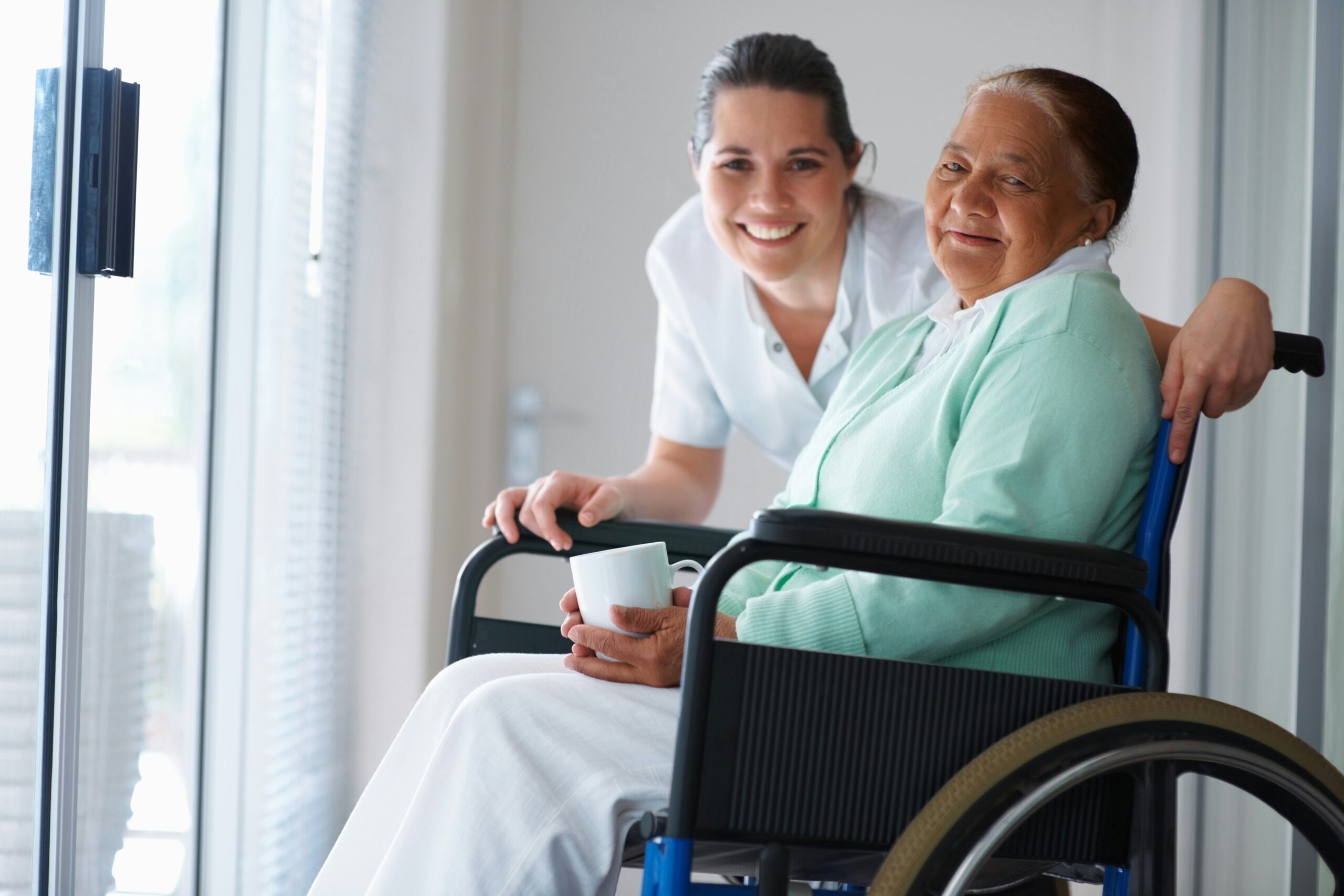 Caregiver having a warm conversation with senior client