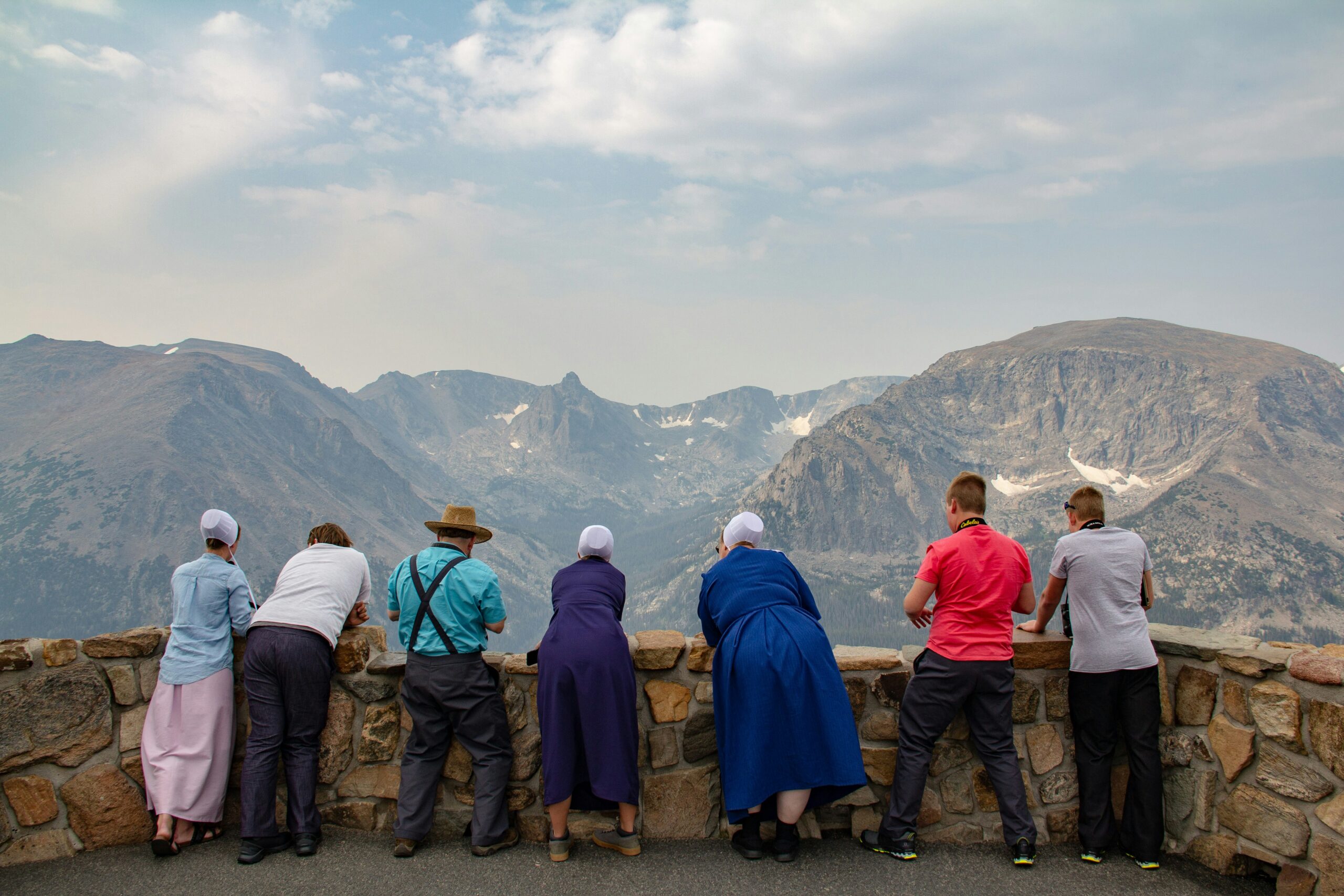 A senior man relaxing comfortably at home in Houston while a caregiver provides supportive presence nearby
